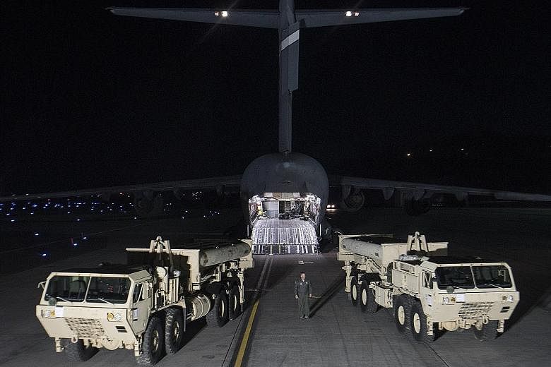 Thaad components flown in at Osan Air Base south of Seoul on Monday, hours after North Korea launched four missiles.