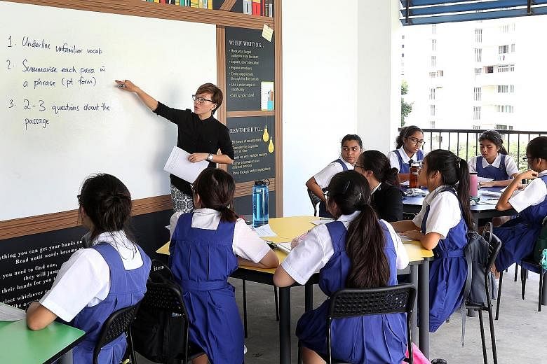 CHIJ St Theresa's Convent teacher Donna Koh conducting a Sec 4 English lesson in a class of N(A) and N(T) students.