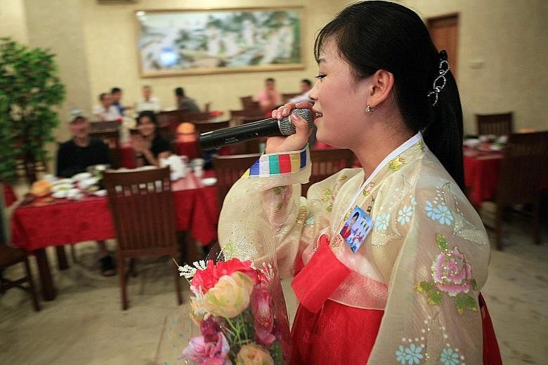 Customers in Jakarta, Indonesia listening to North Korean songs in a restaurant managed by Pyongyang to generate earnings overseas in this 2010 photo. North Korea has also ventured to other countries in Asean but its Friendship Restaurant (below) in 