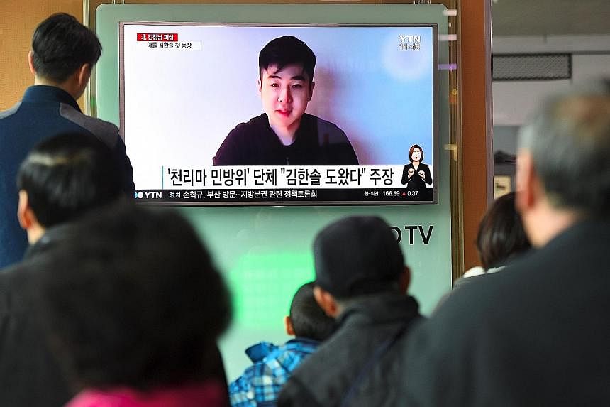 A TV news report in Seoul yesterday showing the video in which Mr Kim Han Sol speaks about his father's murder and says he is with his mother and sister.