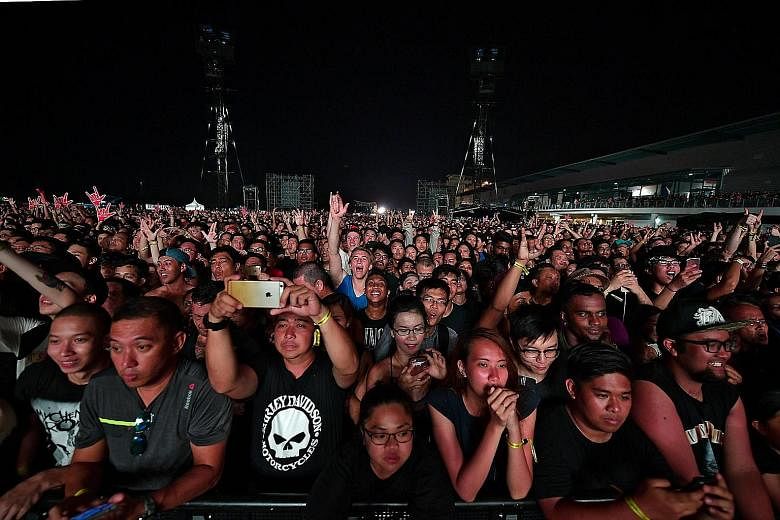 The crowd at American rock band Guns N' Roses' concert at Changi Exhibition Centre last month. Under changes to the Public Order Act introduced in Parliament yesterday, organisers of public events must notify police at least 28 days beforehand if the