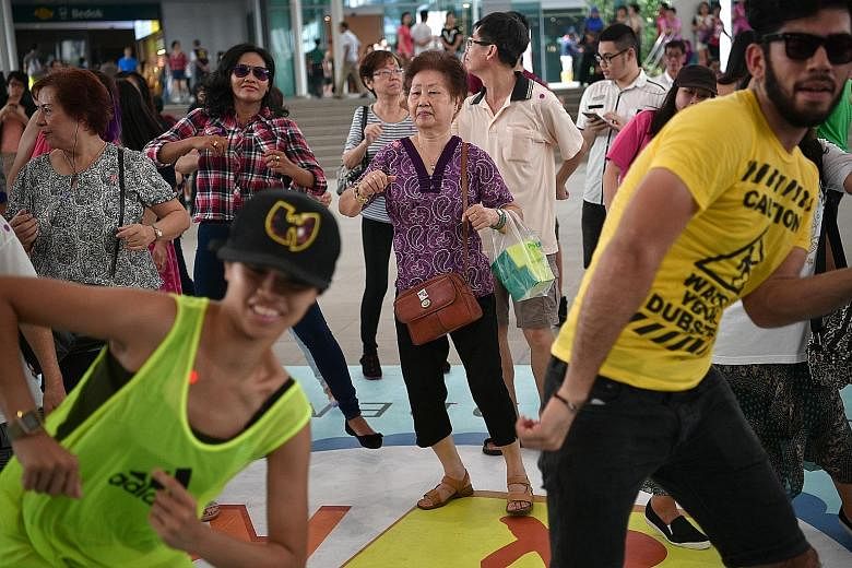 Participants at a community dance event to get people moving last year. The Ministry of Health wants individuals to take charge of their health, and will help them through a slew of programmes to spur lifestyle change. Measures to make arts and sport