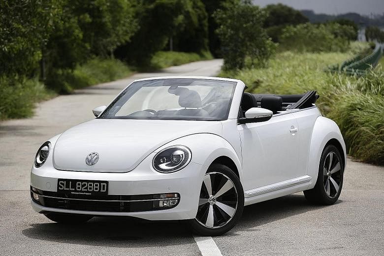 The Beetle Cabriolet's Fender hi-fi system works well with the top down and the car's cockpit (far left) is a tribute to the iconic car baby boomers grew up with.