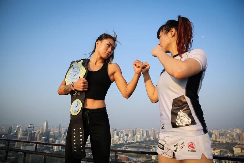 One Championship's Angela Lee (left) and Jenny Huang going toe to toe at the Banyan Tree Bangkok's Vertigo and Moon Bar. Their title fight will anchor today's One: Warrior Kingdom, with atomweight belt holder Lee looking to send the Chinese Taipei fighter
