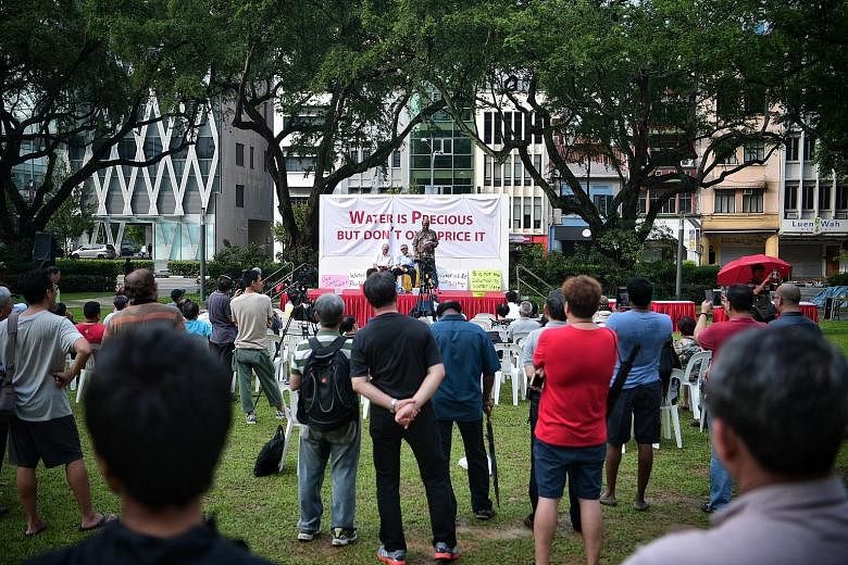 Dr Paul Tambyah speaking at Hong Lim Park yesterday. He said the rise in water prices came at a time of "economic hardship".
