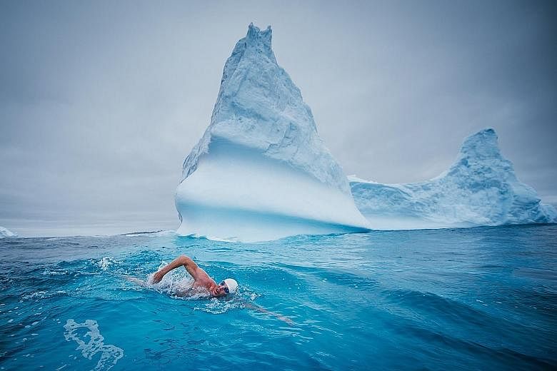 Mr Pugh swimming in the Antarctica. Through his swims, he hopes to secure more marine protection for the vulnerable seas in the Antarctic area, which collectively spans about 7 million sq km, roughly the size of Australia.