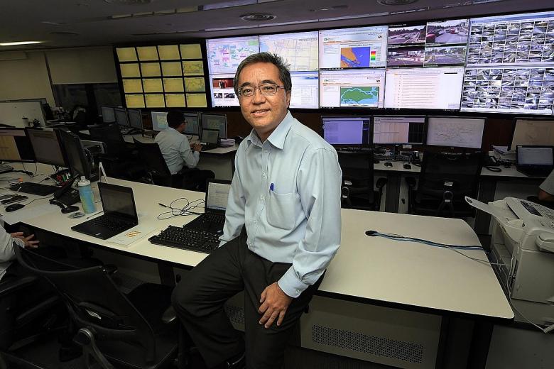 Mr Bernard Koh in the PUB control centre at the Environment Building in Scotts Road. The screens display information on Singapore's water infrastructure in real-time.