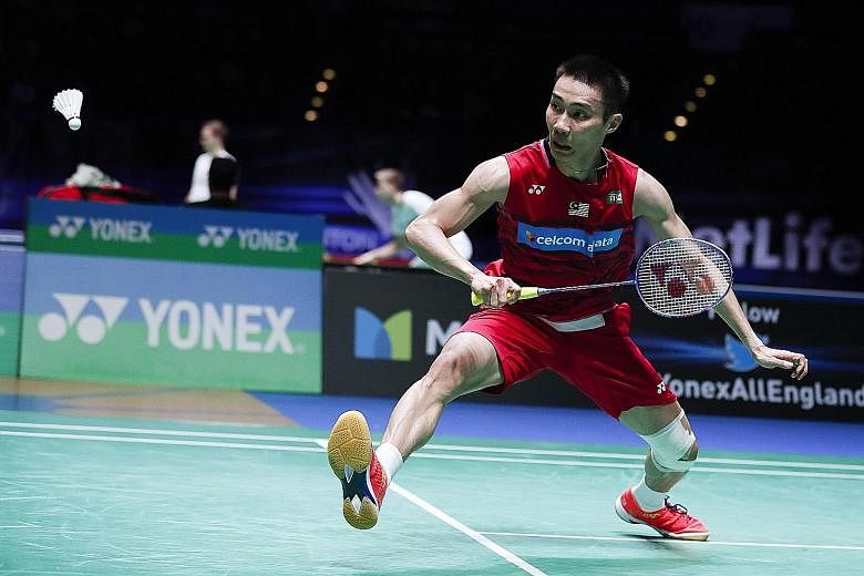 Malaysia's Lee Chong Wei retrieving a shot by Chinese rival Tian Houwei in the quarter-finals of the All England Open. The four-time champion also came from behind to beat Chou Tien-chen of Chinese Taipei 10-21, 21-14, 21-9 in their semi-final.