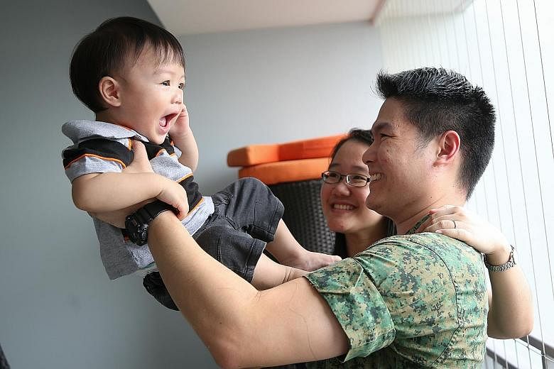Mr Lim with his wife Joanne and son Benjamin. With the Singapore Armed Forces becoming a more advanced fighting force, which leverages the latest in weapons and training systems, the ICT cycle can be reduced without compromising the SAF's operational