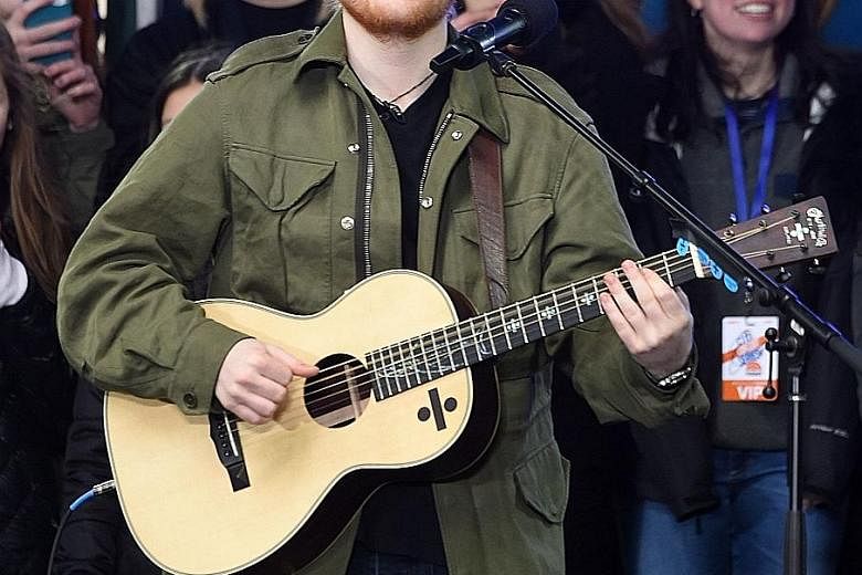 Ed Sheeran's new album ÷, pronounced "divide", is the fastest selling by a solo male artist in British chart history.