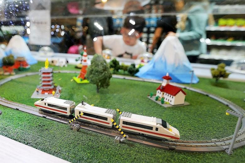  Spot Singapore's Merlion in brick form and look out for the nanoGauge train (above) - modelled after Japan's most famous train, the shinkansen bullet train, as it moves around a railway track. Some 80,000 to 100,000 of the micro-sized building blocks wer