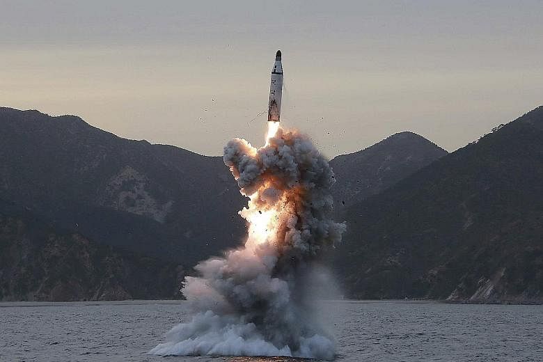 An undated file photo of a submarine ballistic missile being test-fired in an undisclosed location in North Korea.