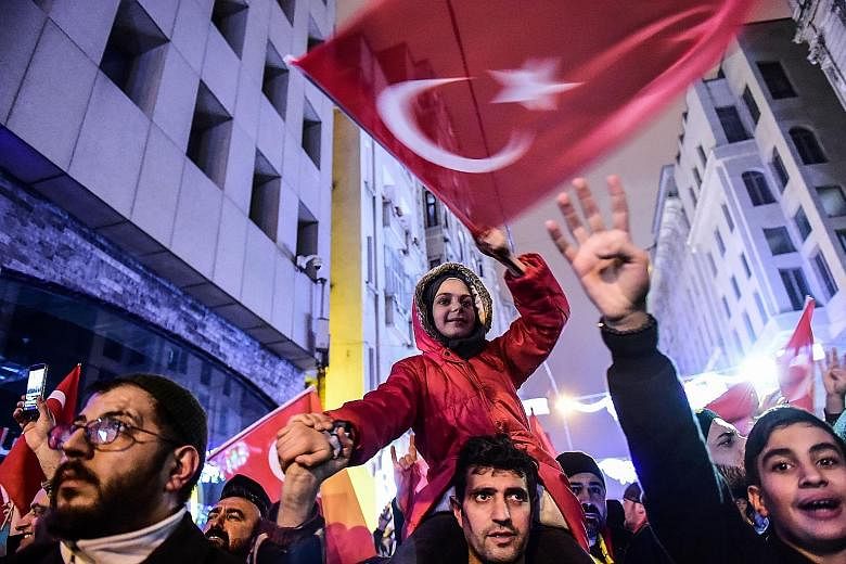 Ms Fatma Betul Sayan Kaya (above) was prevented from addressing a rally in Rotterdam and expelled from the Netherlands. In Istanbul (left), demonstrators staged a protest in front of the Dutch consulate on Saturday.
