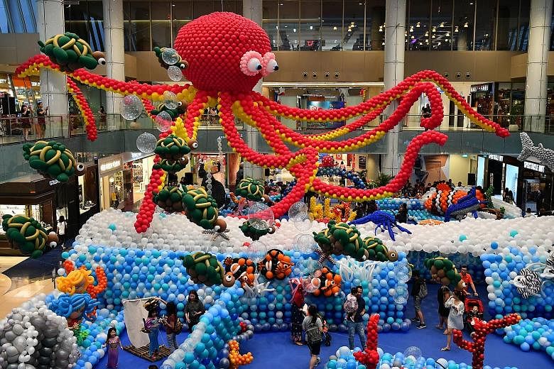 This aquatic wonderland - made with 100,000 inflated balloons - at the Central Atrium of Marina Square was assembled by 45 world-class balloon artists from nine countries. They took four days to complete the display, which features marine creatures s