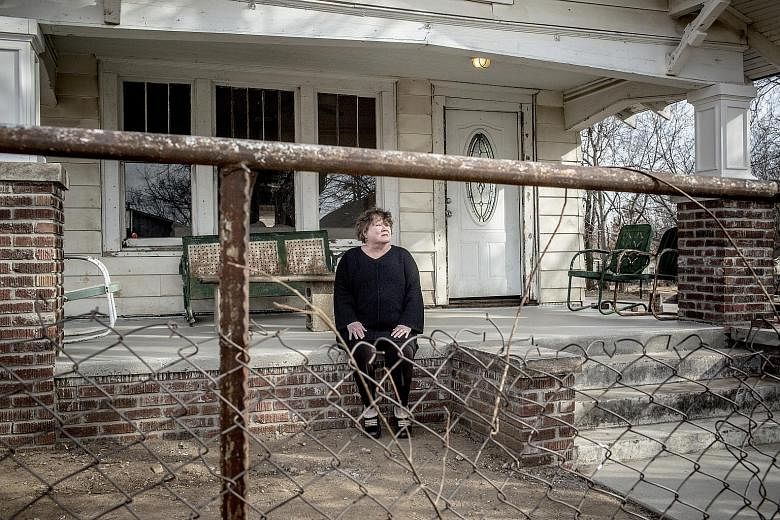 Author S.E. Hinton outside the house used as Ponyboy Curtis' home in the 1983 film adaptation of her book The Outsiders. The home in Tulsa, Oklahama, is undergoing renovation as a part of a fan-driven project to turn it into a museum dedicated to the