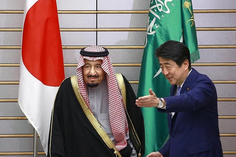 PM Shinzo Abe greeting the Saudi King, who is the first monarch from the Middle East kingdom to visit Japan in 46 years, before a meeting at the PM's official residence in Tokyo yesterday. Under the Saudi-Japan Vision 2030, special deregulated econom