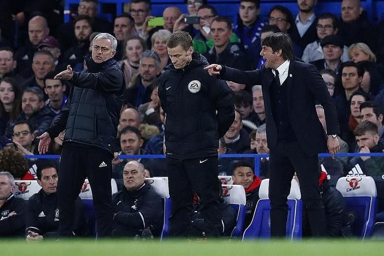 Fourth official Mike Jones peering down stoically at the turf while Jose Mourinho (left) and Antonio Conte vent their respective frustrations during the Blues' 1-0 win against Manchester United in the FA Cup quarter-finals.