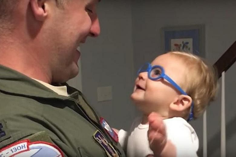 Reagan, who had GBS shortly after birth, seeing his father clearly for the first time ever, through special glasses.
