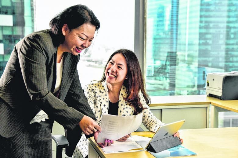 President and head of Asia ex-Japan at Nikko AM, Ms Eleanor Seet (right), with her secretary Rose Lim. The firm is proactive when it comes to helping mothers in their career development and lifestyle needs.