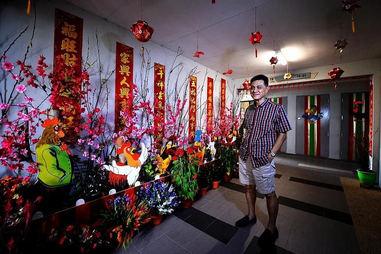 Mr Tham creates displays at the lift lobby outside his flat in Dover Crescent to mark festivals. He keeps fire-retardant paint and a fire extinguisher at hand and has not encountered problems with the authorities.