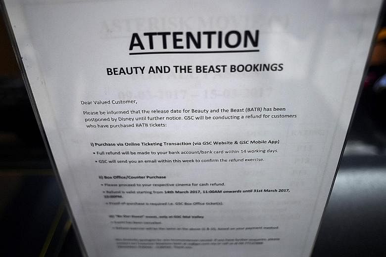 A notice put up at a Golden Screen Cinemas theatre in Kuala Lumpur regarding the "postponed" release of the Disney movie, Beauty And The Beast, and ticket refunds.