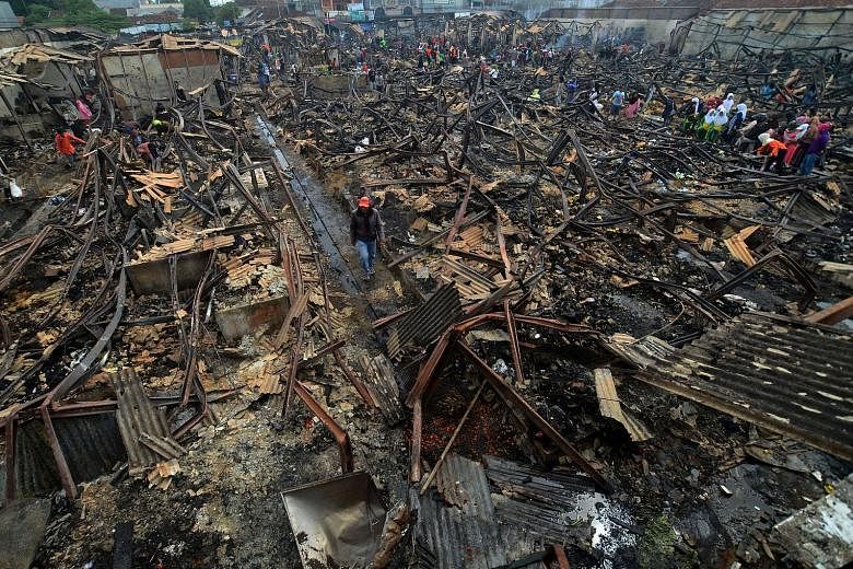 The Manonjaya market in Tasikmalaya, West Java, Indonesia, was destroyed during an overnight fire yesterday. A witness said the fire, which shop owners blamed on an electrical short-circuit, spread quickly, burning 300 kiosks in just half an hour. Th