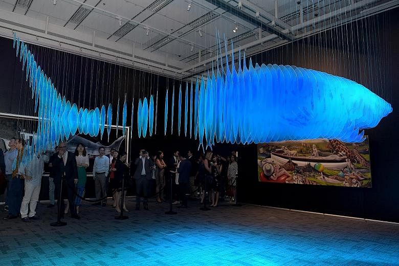 The 4m-long shark hangs frozen in mid-air, bathed in cold blue light, silently greeting those who walk through the museum's dim corridors. To create the work Don't Copy II, artist Li Jiwei suspended more than 70 pieces of plastic from the ceiling. Th