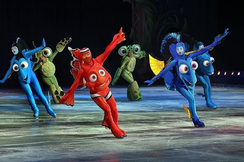 Megan Taylor plays the blue tang, Dory, in The Wonderful World Of Disney On Ice show. T.J. Yang plays the role of Marlin (left).