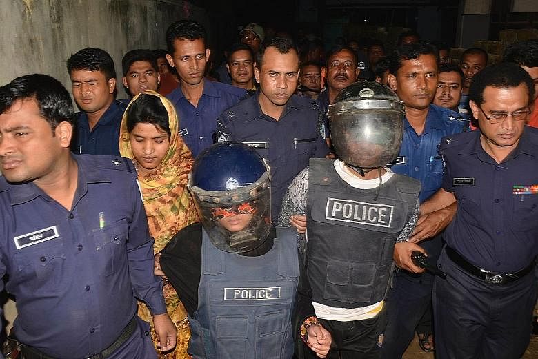 Bangladesh police detaining a couple for suspected terror links yesterday. Four militants from the New JMB group were killed in a shootout during an earlier police raid.