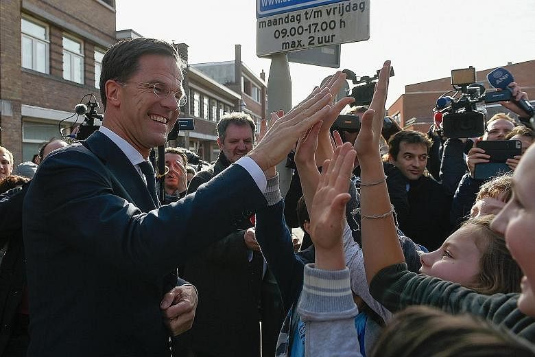 The Netherlands' Prime Minister and VVD party leader Mark Rutte after casting his ballot at a polling station in The Hague on Wednesday. "The Netherlands, after Brexit and the American elections, said 'stop' to the wrong kind of populism," he told su