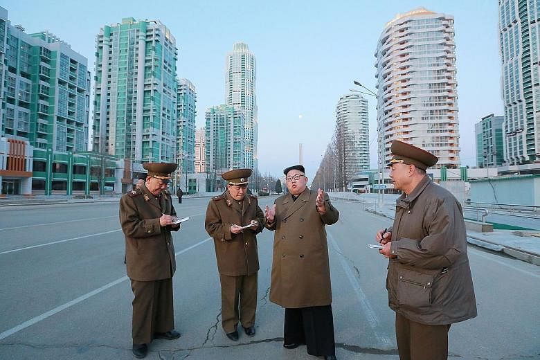 An undated photo showing North Korean leader Kim Jong Un in Ryomyong Street, Pyongyang. North Korea yesterday blamed the US and South Korea for the murder of his half-brother, Mr Kim Jong Nam.