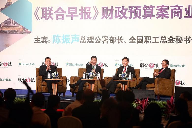 At the Lianhe Zaobao Singapore Budget Business Forum at Shangri-La Hotel yesterday was Minister in the Prime Minister's Office Chan Chun Sing (second from right). Mr Chan joined (from left) Mr Thomas Pek, Lianhe Zaobao editor Goh Sin Teck and Mr Rola