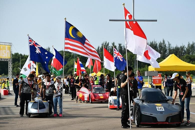 Teams at the starting line at the Shell Eco-marathon Asia competition yesterday. The search for sustainable urban solutions was urgent and required coordinated action, said DPM Teo at the contest's launch.
