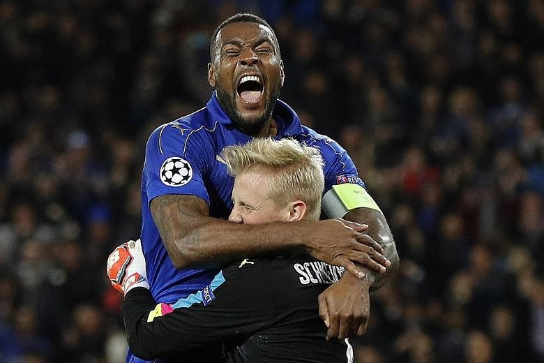 Leicester goalkeeper Kasper Schmeichel celebrating after saving Steven N'Zonzi's 80th-minute penalty. Leicester went through 3-2 on aggregate but the underdogs will face their toughest challenge in Atletico.