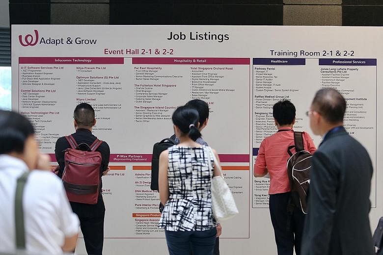 Job seekers at a fair organised by Workforce Singapore and the Employment and Employability Institute yesterday. Unemployed PMETs can look forward to more such smaller-scale job fairs in a bid to help PMETs find work sooner, and keep the long-term un