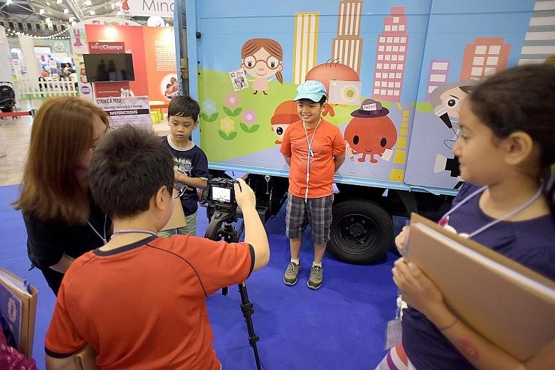 Pupils turned picture editors yesterday as they decided which picture of Joseph Schooling should be used for their story at the ST Young Storymakers Camp, a highlight of the sixth SmartKids Asia exhibition. The children got to have their byline photo