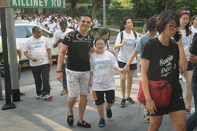 The 2.2km buddy walk yesterday began from Dhoby Ghaut Green, which was also the site of a carnival. Down syndrome affects about one in 800 babies worldwide.