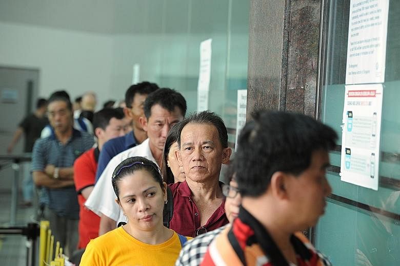 People queueing to file their tax returns at the Inland Revenue Authority of Singapore's office in Newton Road on April 13 last year as the deadline for filing taxes loomed. Skip the queues and file your taxes online instead.