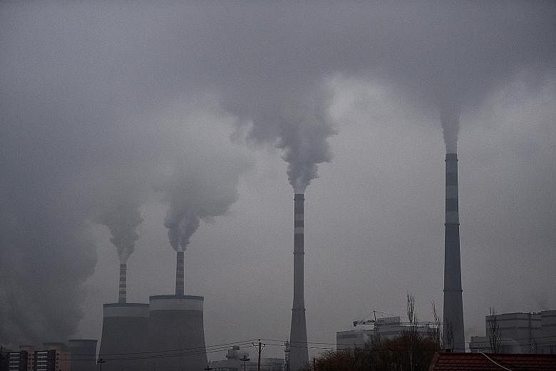 Smoke from a coal-fuelled power station in China. Germany, in taking a cautious path in promoting its climate change and energy agenda, has not scheduled formal meetings for environment ministers even as it is expected to submit a plan to G-20 nation