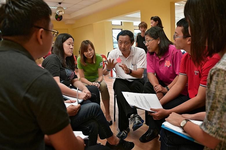 A psychological first aid training session being held for volunteers from Ang Mo Kio GRC on March 12. Psychologists taught them how to stabilise situations after a crisis, approach those affected and identify signs of distress.