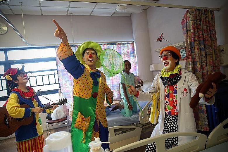 It is International Day of Happiness today and these clowns are wasting no time in bringing cheer to those who need it most. Every last Saturday of the month, the volunteers visit the paediatric wards of KK Women's and Children's Hospital to sculpt b