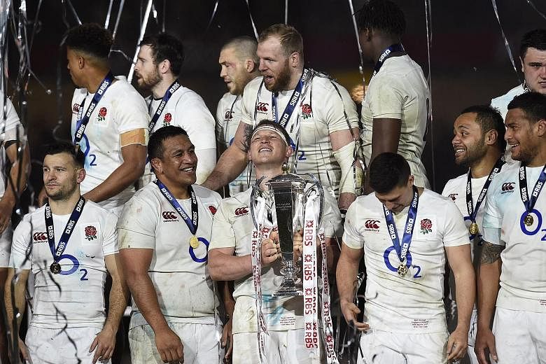 England rugby union hooker and captain Dylan Hartley lifting the Six Nations trophy in Dublin. After losing 9-13 to Ireland, the side remain tied with New Zealand on 18 straight Test wins.