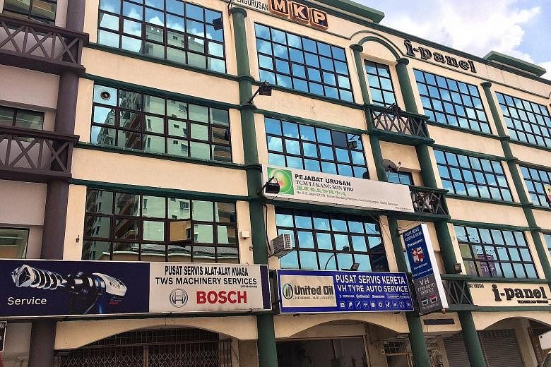An MKP subsidiary's office (left) is shuttered, with old bills from 2015 left behind. Meanwhile, North Korean partner Han Hun Il's apartment in Kuala Lumpur appeared occupied, but no one answered when The Straits Times visited. Malaysian firm MKP Hol