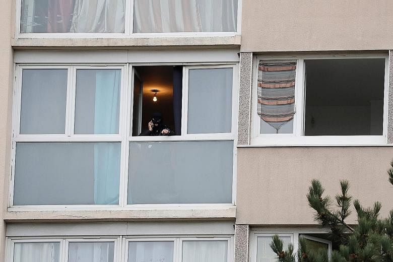 A police officer at the attacker's apartment in the multi-ethnic Paris suburb of Garges-les- Gonesse. Officers found cocaine in the residence. Ziyed Ben Belgacem had nine entries on his criminal record and was under judicial monitoring.