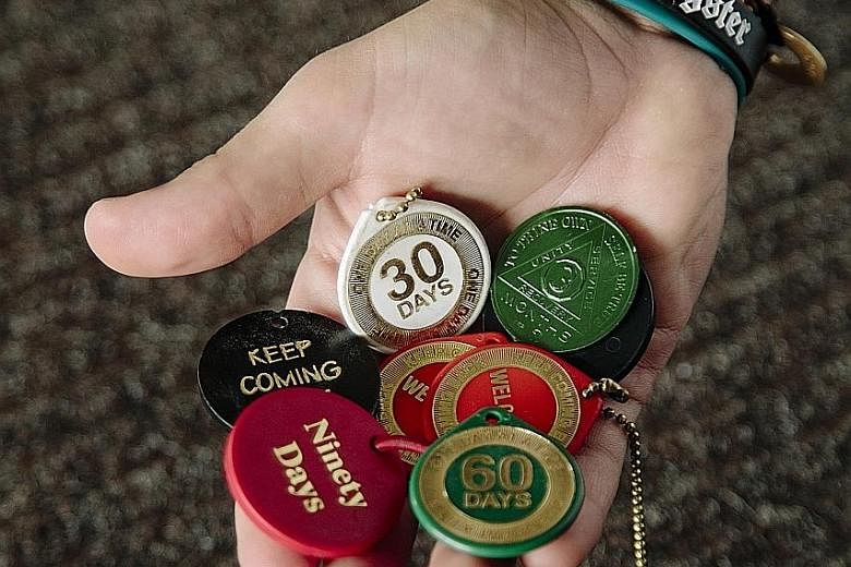 Mr Jordan holds tokens of his sobriety. It was the 33-year-old's 118th day sober. Mr Jordan, a college-educated son of two therapists, is in rehab for the third time. He had smoked pot, taken ecstasy and snorted cocaine, and got hooked on heroin when
