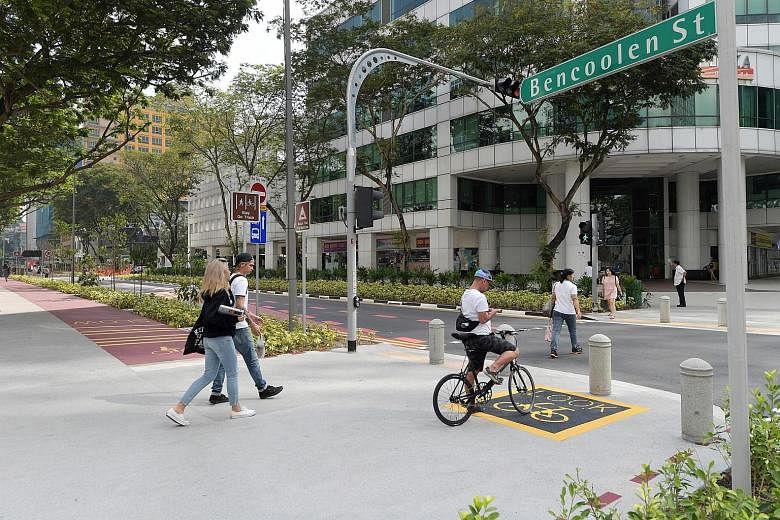 New features in Bencoolen Street include a wider pedestrian walkway and a cycling path as part of Singapore's car-lite drive.