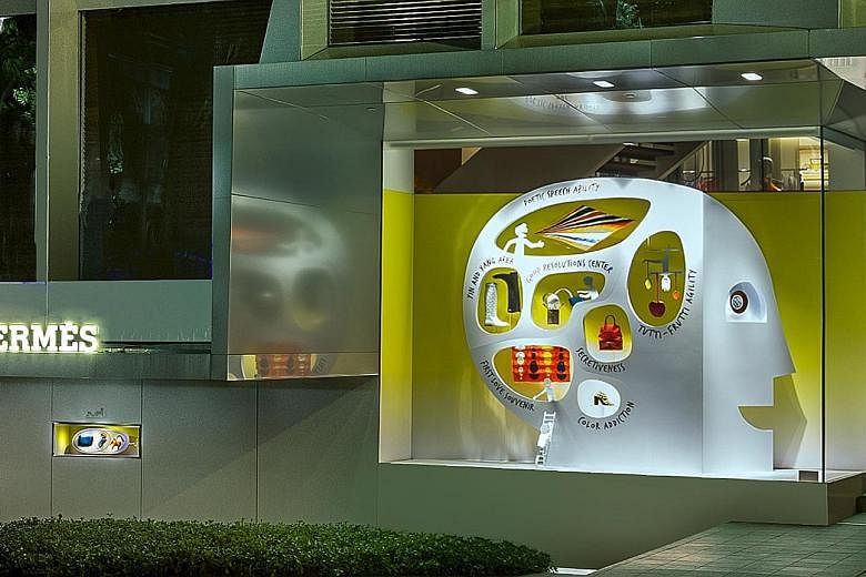 This sculpture sitting in the window of French luxury brand Hermes' flagship store at Liat Towers is the store's latest art installation. Named Smart Objects, the piece is designed by French artist Julien Amouroux, who works under the name of Le Gent