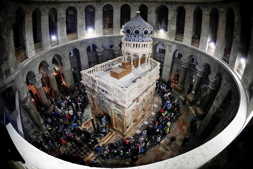 The ornate shrine surrounding what is believed to be the tomb of Jesus Christ was reopened in Jerusalem yesterday following months of delicate restoration work. Religious leaders opened the ceremony at the Church of the Holy Sepulchre, built at the s