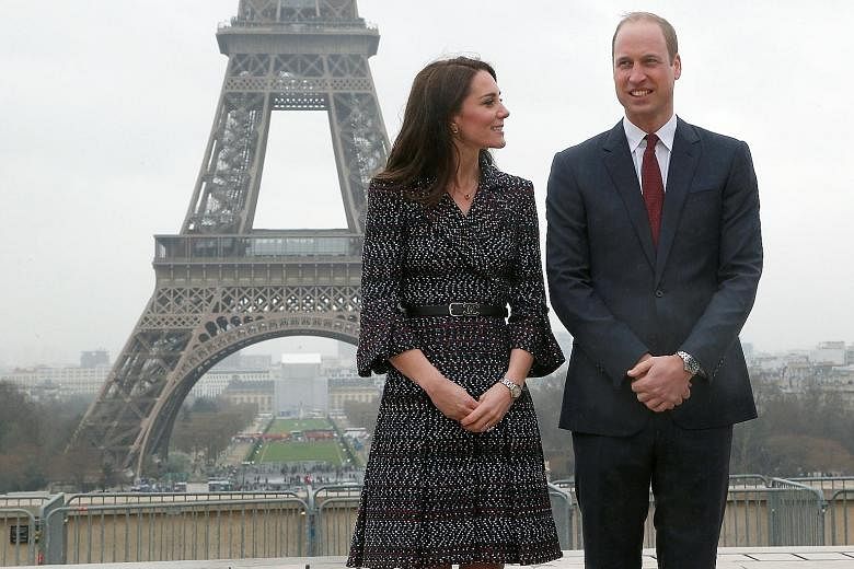 Britain's Prince William and the Duchess of Cambridge, who wore a dress and belt by French fashion house Chanel as well as Cartier accessories on their first official visit to Paris.