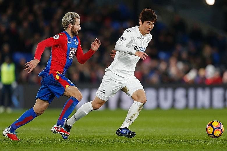 South Korea will be able to call on Swansea City midfielder Ki Sung Yueng, seen here keeping the ball away from Crystal Palace midfielder Yohan Cabaye in an English Premier League match.